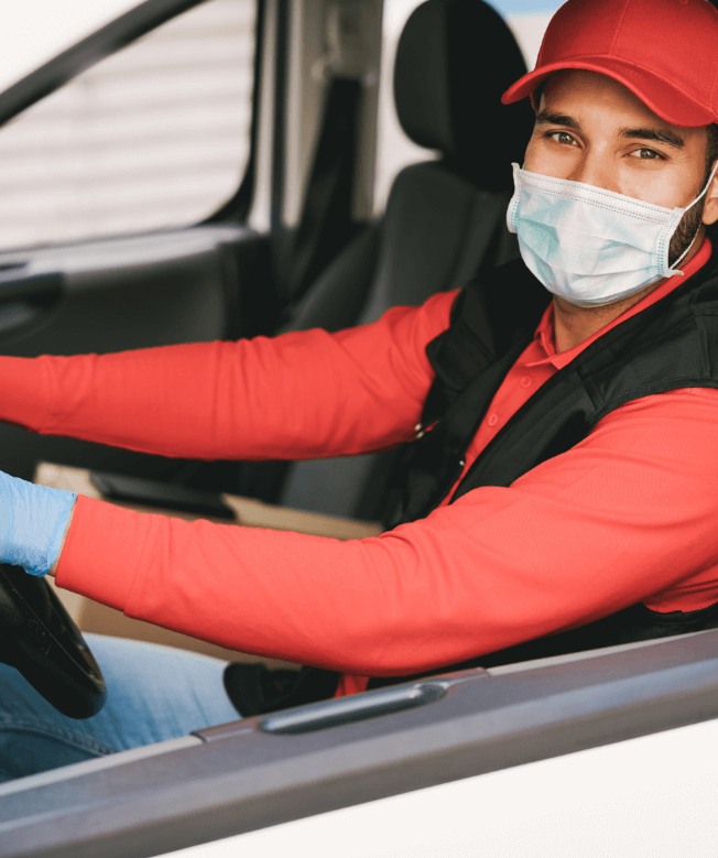 delivery-man-driving-van-during-coronavirus-outbreak.png